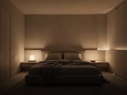 Ein minimalistisches, modern eingerichtetes Schlafzimmer mit stimmungsvoller, warmer Beleuchtung in einer ruhigen Atmosphäre. - Foto: über boerse-global.de