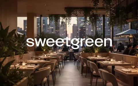 Modernes, hochwertiges Restaurantinterieur in der Abenddämmerung mit natürlicher Beleuchtung und grünen Akzenten. - Foto: über boerse-global.de