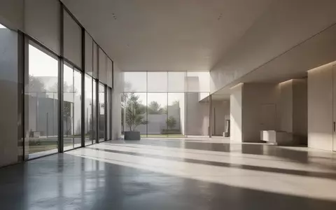 Ein minimalistischer, moderner Innenraum mit klaren architektonischen Linien und natürlichem Lichteinfall. - Foto: über boerse-global.de