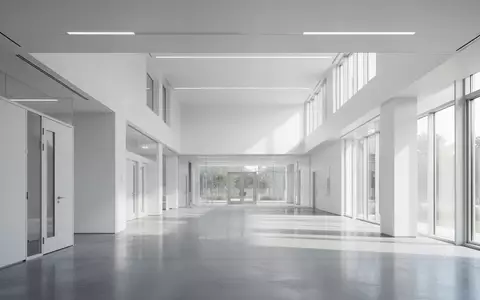 Ein heller, minimalistischer Flur in einem modernen Forschungsgebäude mit klaren architektonischen Linien und Tageslicht. - Foto: über boerse-global.de