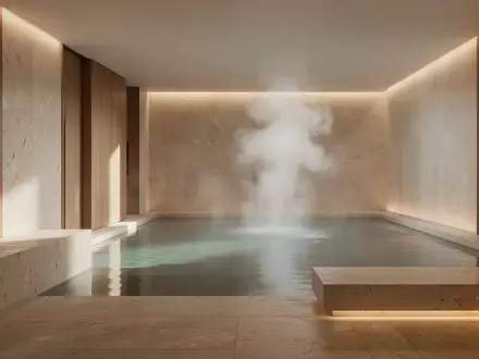 Ein minimalistischer Wellnessbereich mit Naturstein und warmem Licht, der eine Atmosphäre der Ruhe und Regeneration ausstrahlt. - Foto: über boerse-global.de