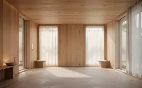 Ein minimalistischer, lichtdurchfluteter Raum mit Holzelementen, der eine ruhige und präventive Gesundheitsatmosphäre vermittelt. - Foto: über boerse-global.de