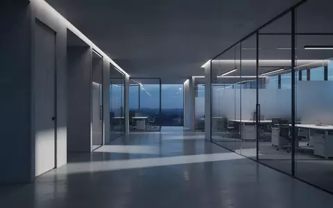 Ein minimalistisches, modern gestaltetes Büro bei Dämmerung mit architektonischen Linien und dezenter blauer Beleuchtung. - Foto: über boerse-global.de