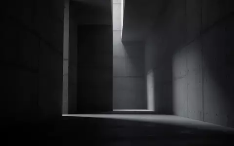 Abstrakte architektonische Innenansicht mit tiefen Schatten und minimalistischen Linien, die eine kühle, industrielle Atmosphäre erzeugt. - Foto: über boerse-global.de