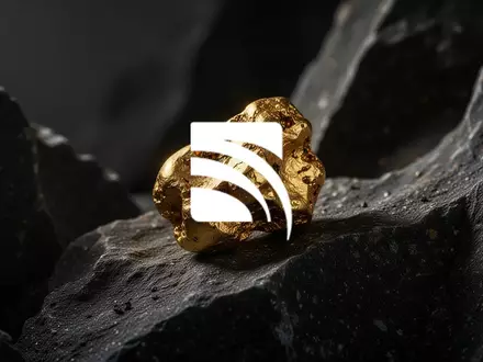 Ein rauer Goldklumpen auf dunklem, geologischem Gestein in einer professionellen, atmosphärischen Aufnahme. - Foto: über boerse-global.de