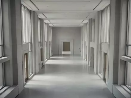 Ein leerer, modern gestalteter Flur in einem Regierungsgebäude mit minimalistischer Architektur und hellem Lichteinfall. - Foto: über boerse-global.de