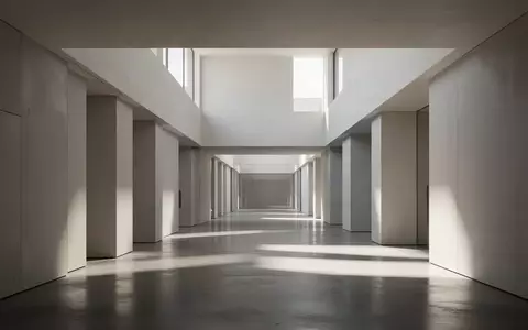 Ein minimalistischer, moderner Flur mit klaren architektonischen Linien und weichem Lichteinfall. - Foto: über boerse-global.de