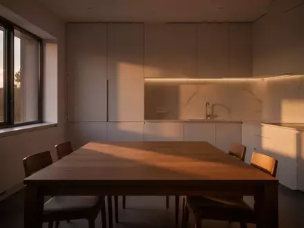 Ein minimalistischer, ruhiger Essbereich in einem modernen Zuhause während der Dämmerung mit natürlichem Licht. - Foto: über boerse-global.de