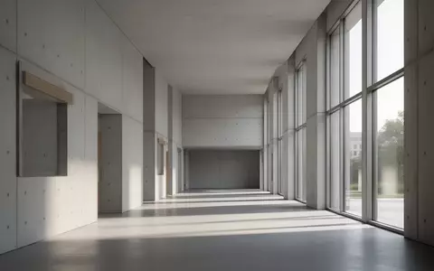 Ein heller, minimalistischer Flur in einem modernen Verwaltungsgebäude bei Tageslicht. - Foto: über boerse-global.de