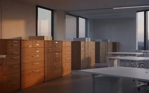 Ein minimalistisches, modernes Büro mit leeren Schreibtischen und Aktenschränken in natürlichem Licht, ohne Personen oder Technik. - Foto: über boerse-global.de