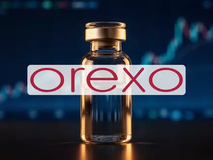 Abstraktes, professionelles Bild einer gläsernen Laborampulle vor einem unscharfen, golden beleuchteten Finanzhintergrund. - Foto: über boerse-global.de