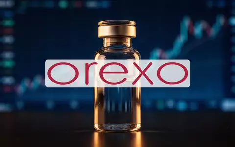 Abstraktes, professionelles Bild einer gläsernen Laborampulle vor einem unscharfen, golden beleuchteten Finanzhintergrund. - Foto: über boerse-global.de