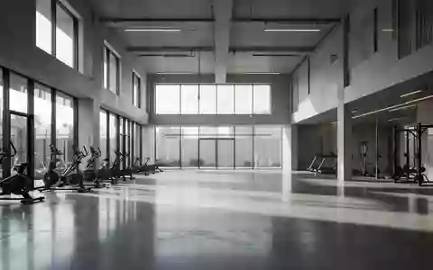 Leerer, minimalistischer Fitnessraum mit hellem Tageslicht und Betonboden in einer modernen Trainingsumgebung. - Foto: über boerse-global.de