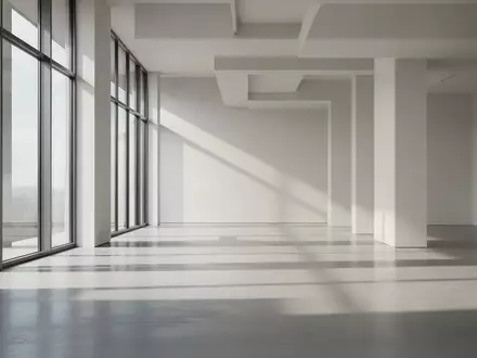 Ein minimalistischer, lichtdurchfluteter Raum mit klaren architektonischen Linien und geometrischen Schattenwürfen. - Foto: über boerse-global.de