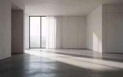Modernes, minimalistisches Architektur-Interieur mit klaren Linien und natürlichem Lichteinfall. - Foto: über boerse-global.de