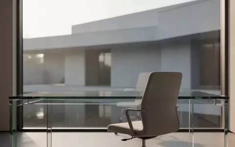 Ein minimalistischer, moderner Arbeitsplatz mit einem leeren Schreibtisch und weichem Tageslicht. - Foto: ĂŒber boerse-global.de