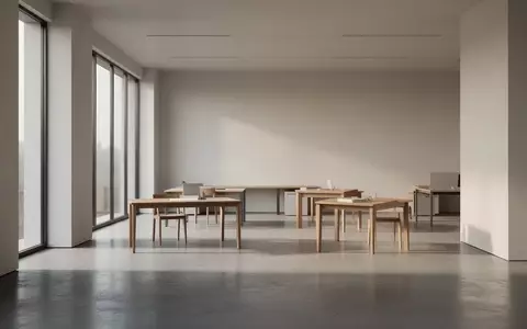 Ein minimalistisches, menschenleeres Büro mit klaren Linien und natürlichem Lichteinfall, das eine ruhige Arbeitsumgebung zeigt. - Foto: über boerse-global.de