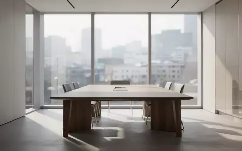 Ein minimalistisch gestalteter Besprechungsraum in einer Steuerkanzlei mit modernem Mobiliar und hellem Tageslicht. - Foto: über boerse-global.de