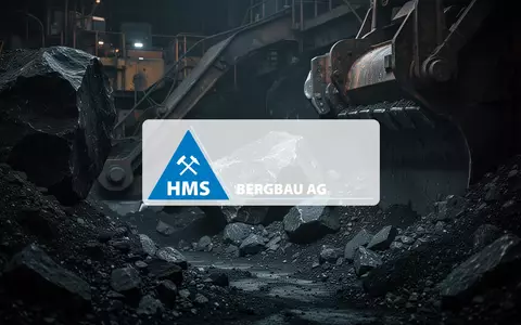 Abstrakte industrielle Szenerie mit dunklen Gesteinsstrukturen und metallischen Reflexen im gedimmten Licht. - Foto: über boerse-global.de