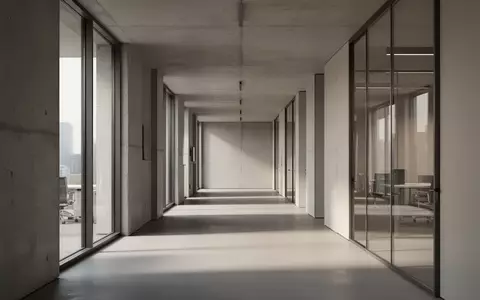 Ein heller, minimalistischer Büroflur mit klaren architektonischen Linien und natürlichem Lichteinfall. - Foto: über boerse-global.de