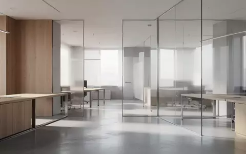 Ein minimalistischer, heller Arbeitsbereich mit moderner Architektur, poliertem Boden und klaren geometrischen Linien. - Foto: über boerse-global.de