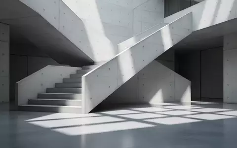 Minimalistische, moderne Architektur mit einer Betontreppe und klaren geometrischen Schattenwürfen. - Foto: über boerse-global.de