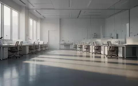 Ein minimalistisches, helles Forschungslabor mit poliertem Betonboden und leeren Arbeitsplätzen in einer ruhigen Umgebung. - Foto: über boerse-global.de
