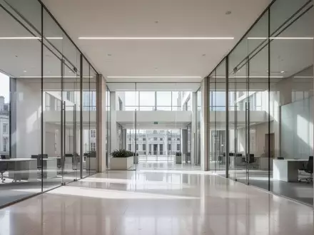 Ein minimalistisches, modernes Bürogebäude mit klaren Linien und natürlichem Licht, ohne Text oder Personen. - Foto: über boerse-global.de
