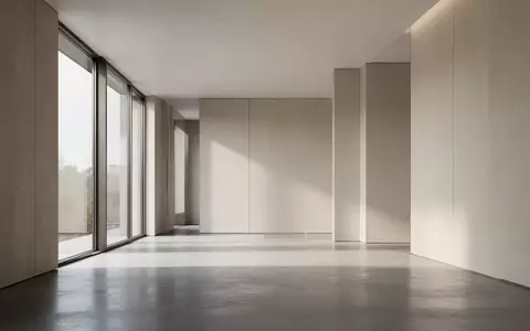 Ein minimalistischer, lichtdurchfluteter Raum mit klaren architektonischen Linien und neutralen Oberflächen. - Foto: über boerse-global.de