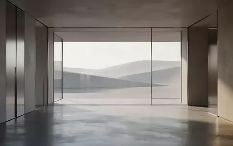 Ein minimalistisch gestalteter Innenraum mit klaren Linien und natürlichem Lichteinfall, der eine ruhige und moderne Atmosphäre vermittelt. - Foto: über boerse-global.de