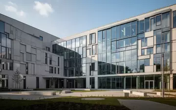 Moderne Forschungsneubauten aus Glas und Beton auf dem Campus der Universitätsmedizin Münster bei Tageslicht. - Foto: über boerse-global.de
