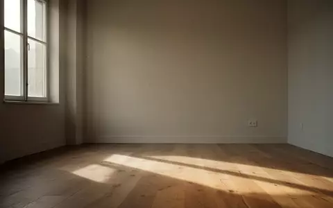 Ein leerer, minimalistischer Raum mit sanftem Morgenlicht und ruhigen Schatten auf einem Holzboden. - Foto: über boerse-global.de