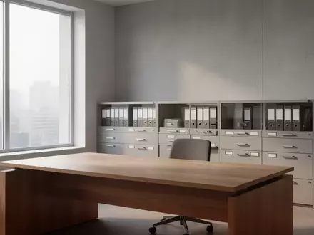 Ein minimalistischer, leerer Schreibtisch in einem hellen, ruhigen Büro mit neutralen Wänden und Aktenschränken im Hintergrund. - Foto: über boerse-global.de