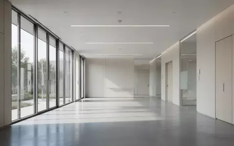 Ein minimalistisches, modernes Interieur einer medizinischen Einrichtung mit klaren Linien und hellem Tageslicht. - Foto: über boerse-global.de
