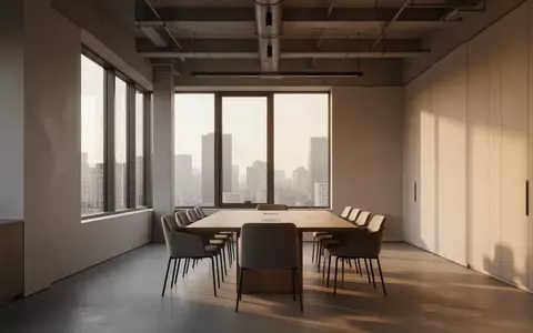 Ein minimalistischer, leerer Konferenzraum in einem modernen Büro mit einfallendem Tageslicht. - Foto: über boerse-global.de