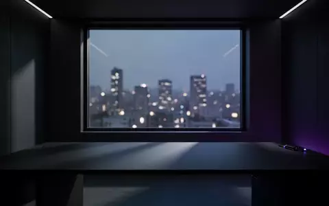 Ein minimalistisch gestalteter, dunkler Gaming-Raum in der Abenddämmerung mit stimmungsvoller Beleuchtung. - Foto: über boerse-global.de