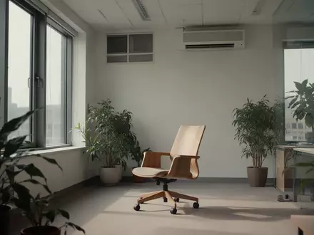 Ein minimalistisch eingerichteter Büroraum mit natürlichem Tageslicht und einer Pflanze, der eine ruhige Arbeitsumgebung zeigt. - Foto: über boerse-global.de