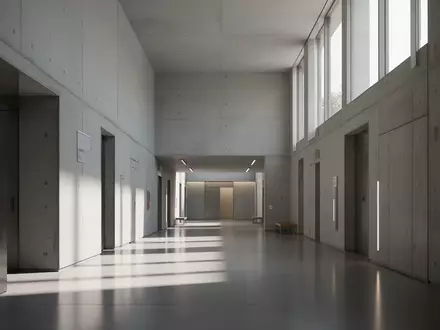 Ein heller, minimalistischer Flur in einem modernen öffentlichen Gebäude mit klaren Linien und natürlichem Lichteinfall. - Foto: über boerse-global.de
