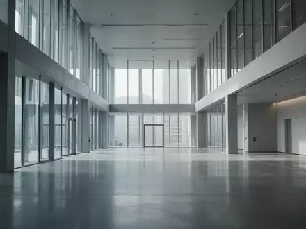 Ein minimalistischer, moderner Innenraum eines Forschungsgebäudes mit klaren Linien und diffusem Tageslicht. - Foto: über boerse-global.de