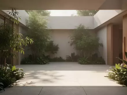 Ein sonnendurchfluteter Innenhof mit minimalistischer Architektur und Pflanzen, der eine ruhige und ausgeglichene Atmosphäre ausstrahlt. - Foto: über boerse-global.de
