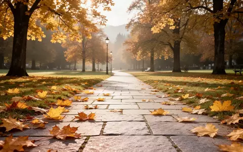 Ein sonniger Parkweg mit herbstlichem Laub in Bayern, der eine ruhige und gesundheitsfördernde Atmosphäre vermittelt. - Foto: über boerse-global.de