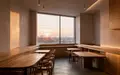 Ein minimalistischer, heller Innenraum eines Cafés mit sauberen Linien und natürlichem Lichteinfall ohne Personen oder Technik. - Foto: über boerse-global.de