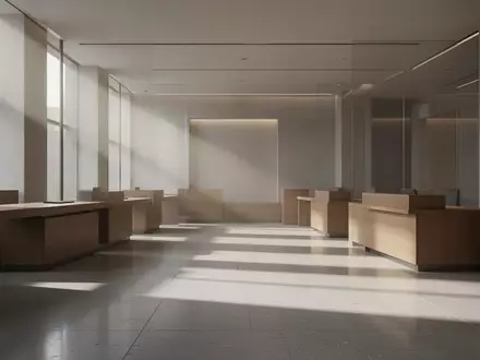 Ein minimalistischer, moderner Bankraum mit leeren Schaltern und sanftem, natürlichem Lichteinfall auf einem Steinboden. - Foto: über boerse-global.de