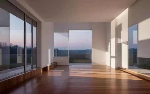 Ein minimalistischer, heller Innenraum mit klaren architektonischen Linien und natürlichem Licht, der Ordnung und Struktur ausstrahlt. - Foto: über boerse-global.de