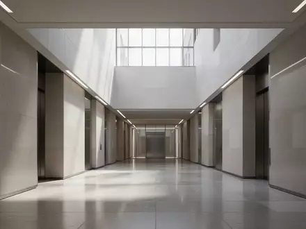 Ein minimalistischer, moderner Flur in einem Regierungsgebäude mit klaren Linien und hellem Tageslicht. - Foto: über boerse-global.de