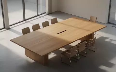 Ein leerer, minimalistischer Konferenztisch in einem sonnendurchfluteten Raum als Symbol für Verhandlungen und Kooperation. - Foto: über boerse-global.de
