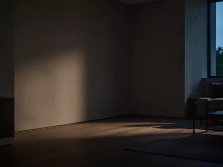 Ein minimalistisch eingerichteter, leerer Wohnraum im Halbdunkel mit langen Schatten, der eine Atmosphäre der Ungewissheit erzeugt. - Foto: über boerse-global.de