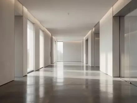 Ein minimalistischer, moderner Innenraum mit klaren architektonischen Linien und sanftem, natürlichem Licht. - Foto: über boerse-global.de