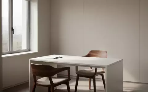 Ein minimalistischer, leerer Behandlungsraum in einer Arztpraxis mit hellem Tageslicht und einem schlichten Schreibtisch. - Foto: ĂĽber boerse-global.de