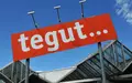 Das Tegut-Logo an einem Standort der Handelskette. - Foto: Uwe Zucchi/dpa